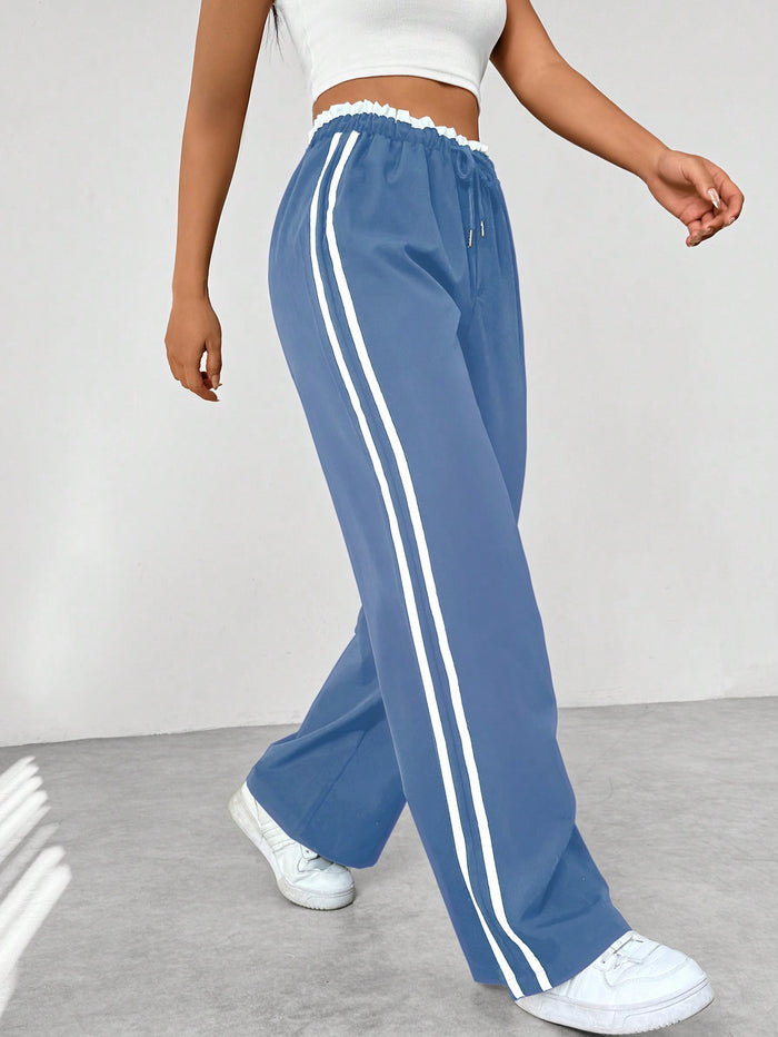 Katia | Pantalón deportivo con cintura alta y rayas laterales corte suelto