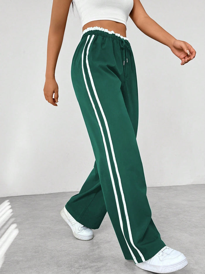 Katia | Pantalón deportivo con cintura alta y rayas laterales corte suelto