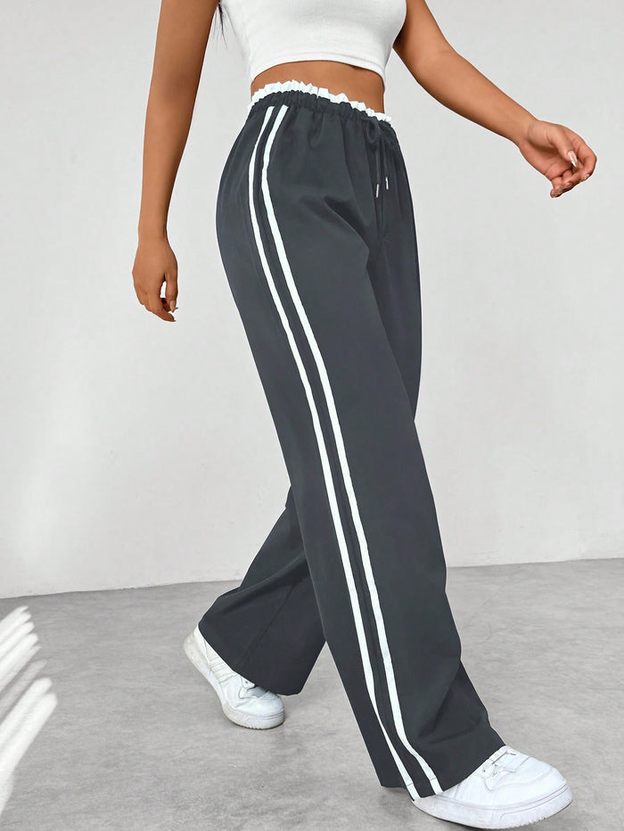 Katia | Pantalón deportivo con cintura alta y rayas laterales corte suelto