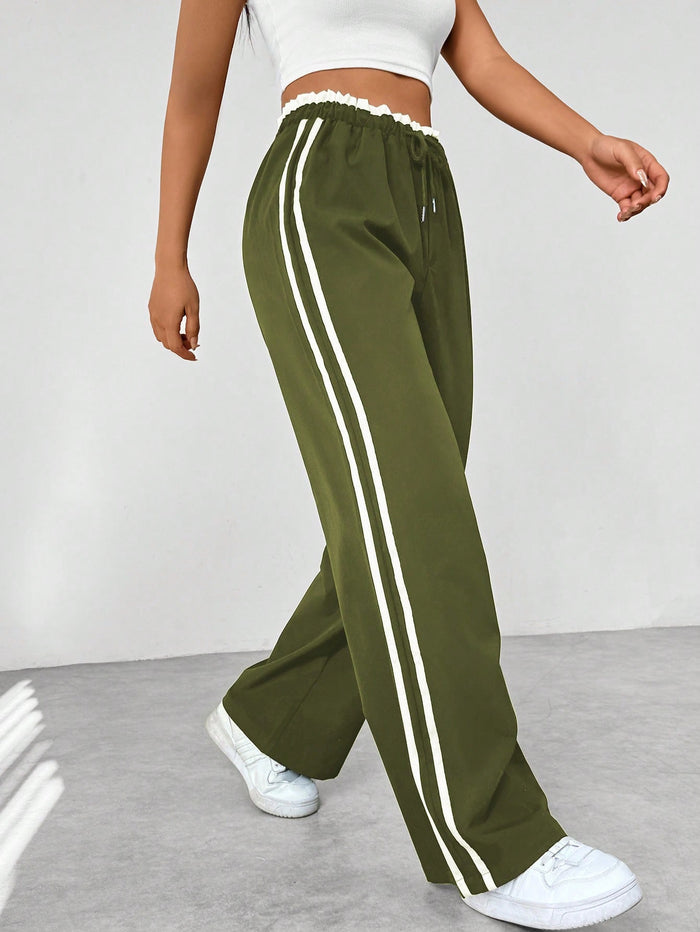 Katia | Pantalón deportivo con cintura alta y rayas laterales corte suelto
