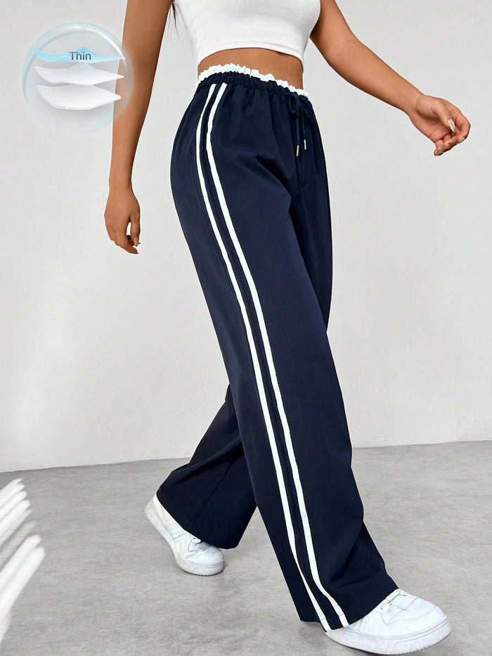 Katia | Pantalón deportivo con cintura alta y rayas laterales corte suelto