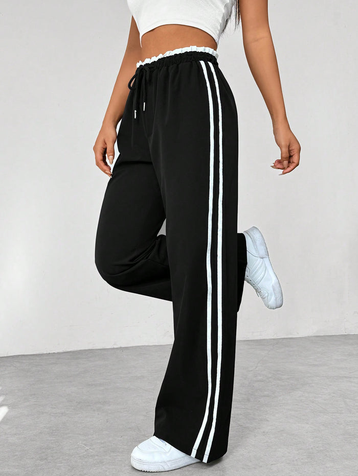 Katia | Pantalón deportivo con cintura alta y rayas laterales corte suelto